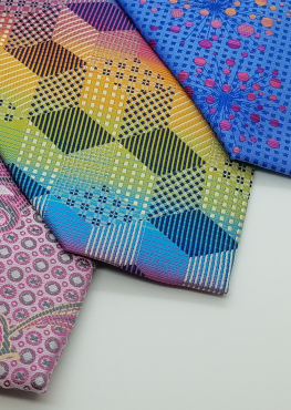 Close up of 3 bold and bright ties