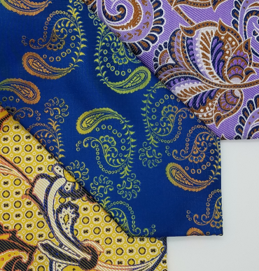 Close up detail of 3 different paisley ties