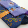 2 socks featuring paisley